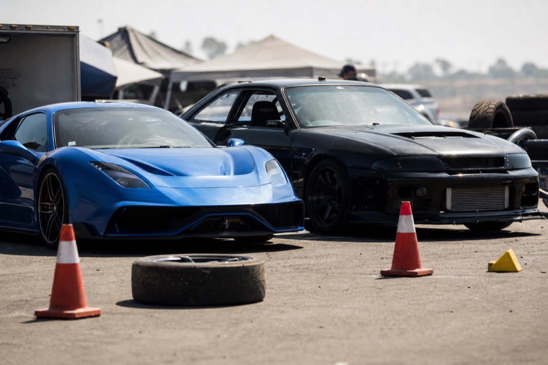 Mixed motorsport cars in the paddock at a Las Vegas racetrack