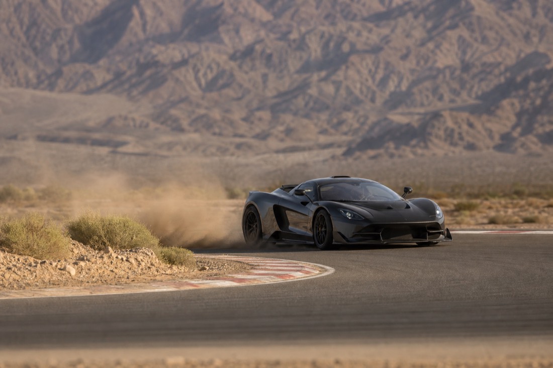 A supercar photographed mid-corner on a desert track near Las Vegas