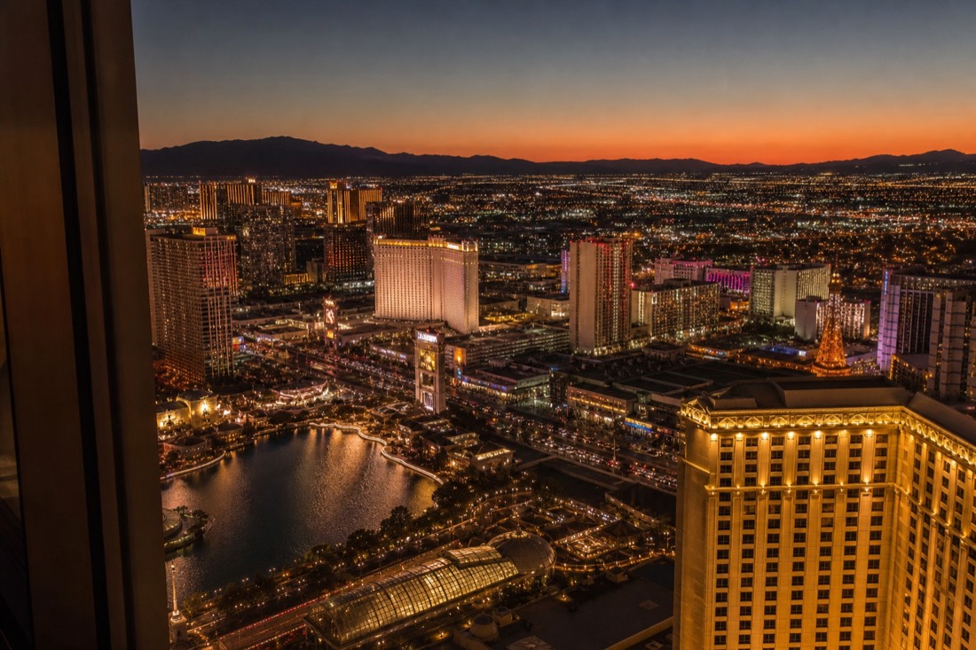 The Las Vegas Strip skyline at dusk from a high hotel window
